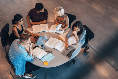 Students studying together at a library table