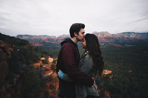 Couple kissing in the wilderness
